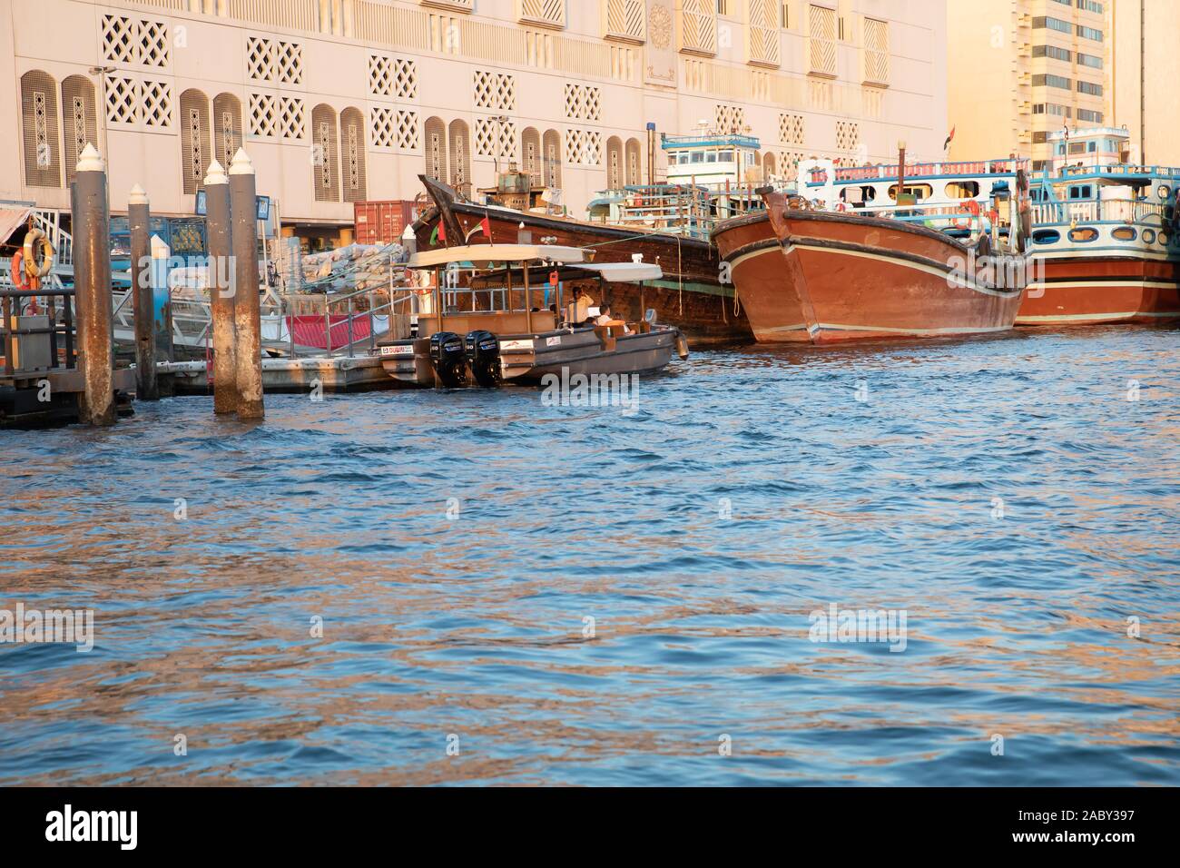 Abras and Dhows on Dubai Creek, UAE Stock Photo