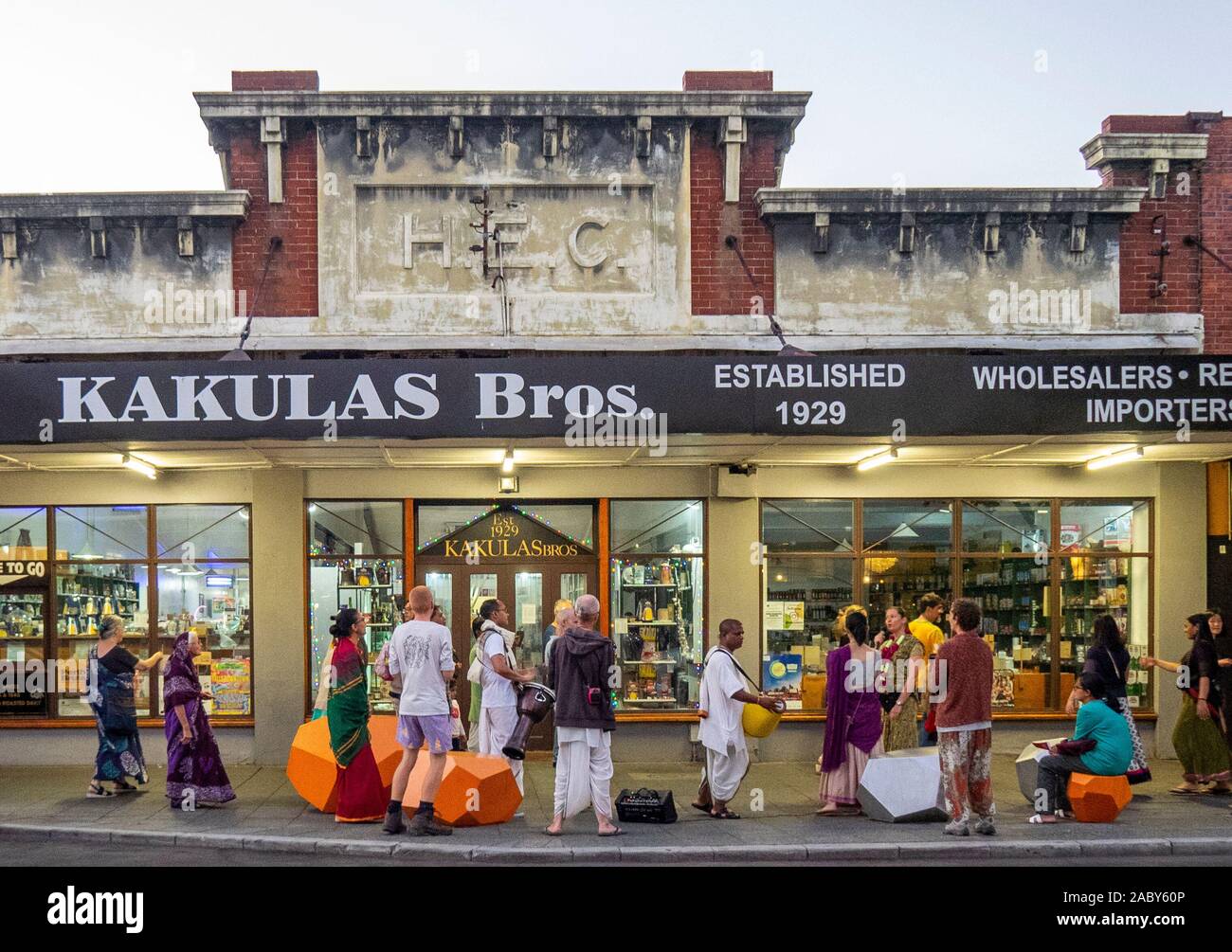 Hare Krishnas supporters dancing and singing in front of Kakulus Bris grocery store on William Street Northbridge Perth Western Australia. Stock Photo