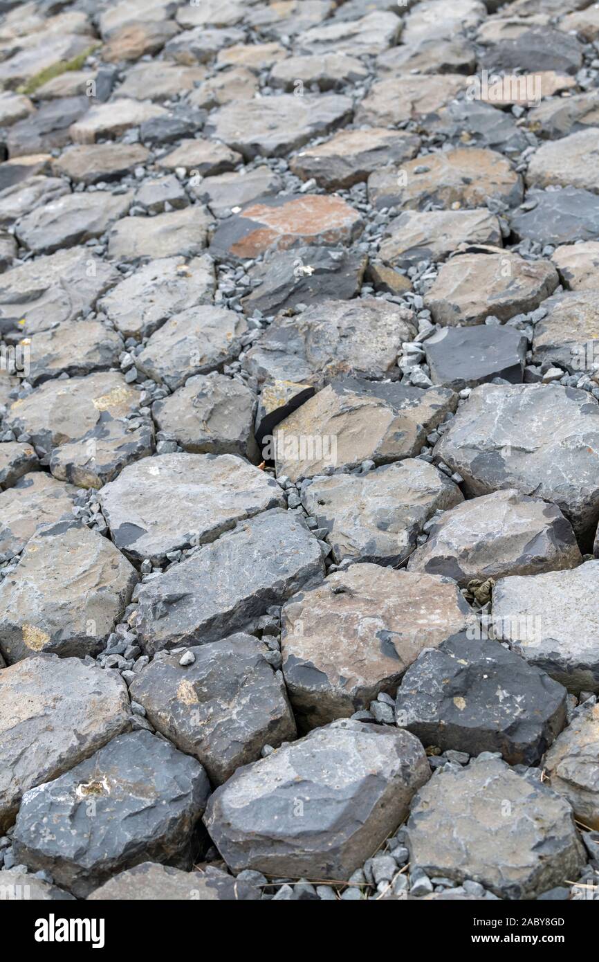 Outer slope coating of basalt rocks in a sea defense in the north of ...