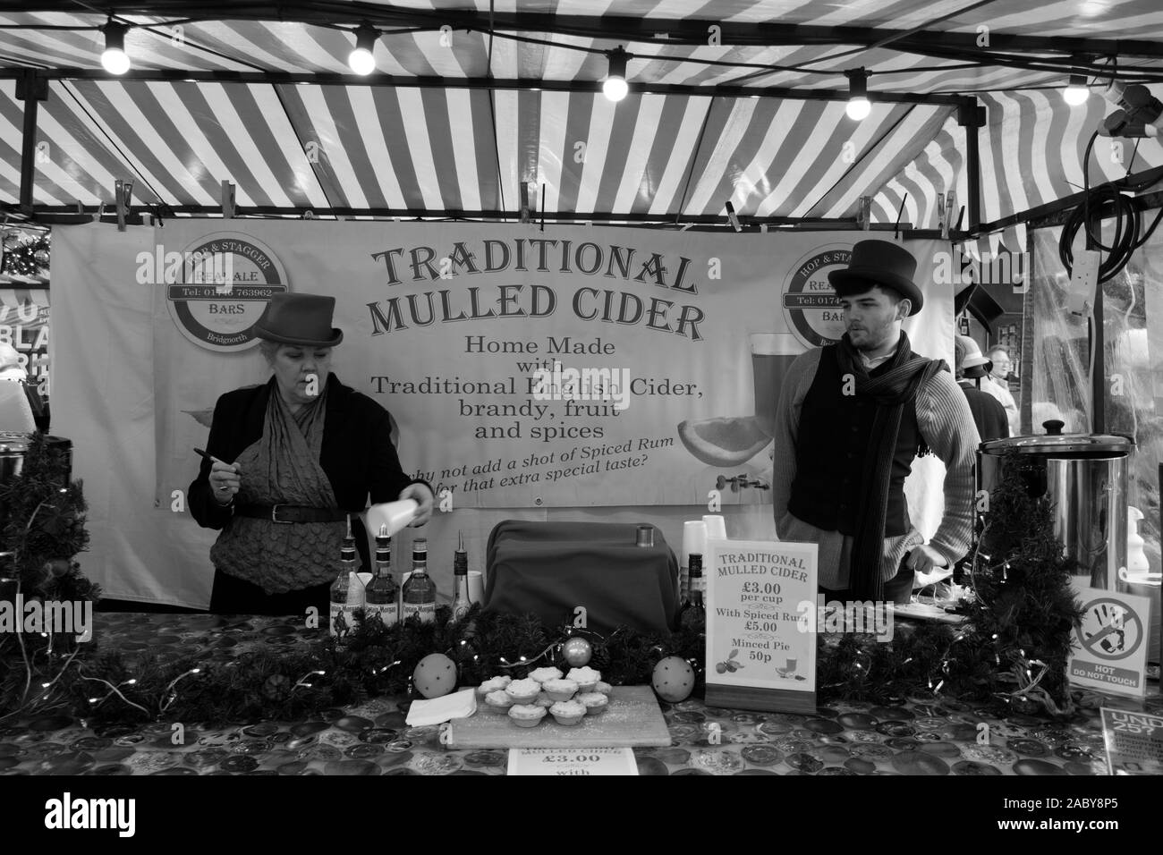 Worcester Victorian Christmas Market. Worcester City, Worcestershire, United Kingdom, 29/11/2019, , The stall holders pose for a victorian photo aroun Stock Photo