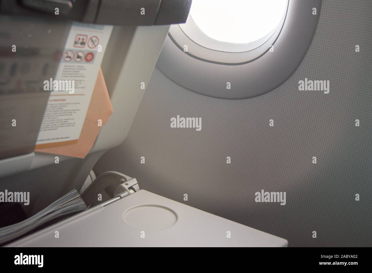 Folding table, flight instructions, magazine in the front seat