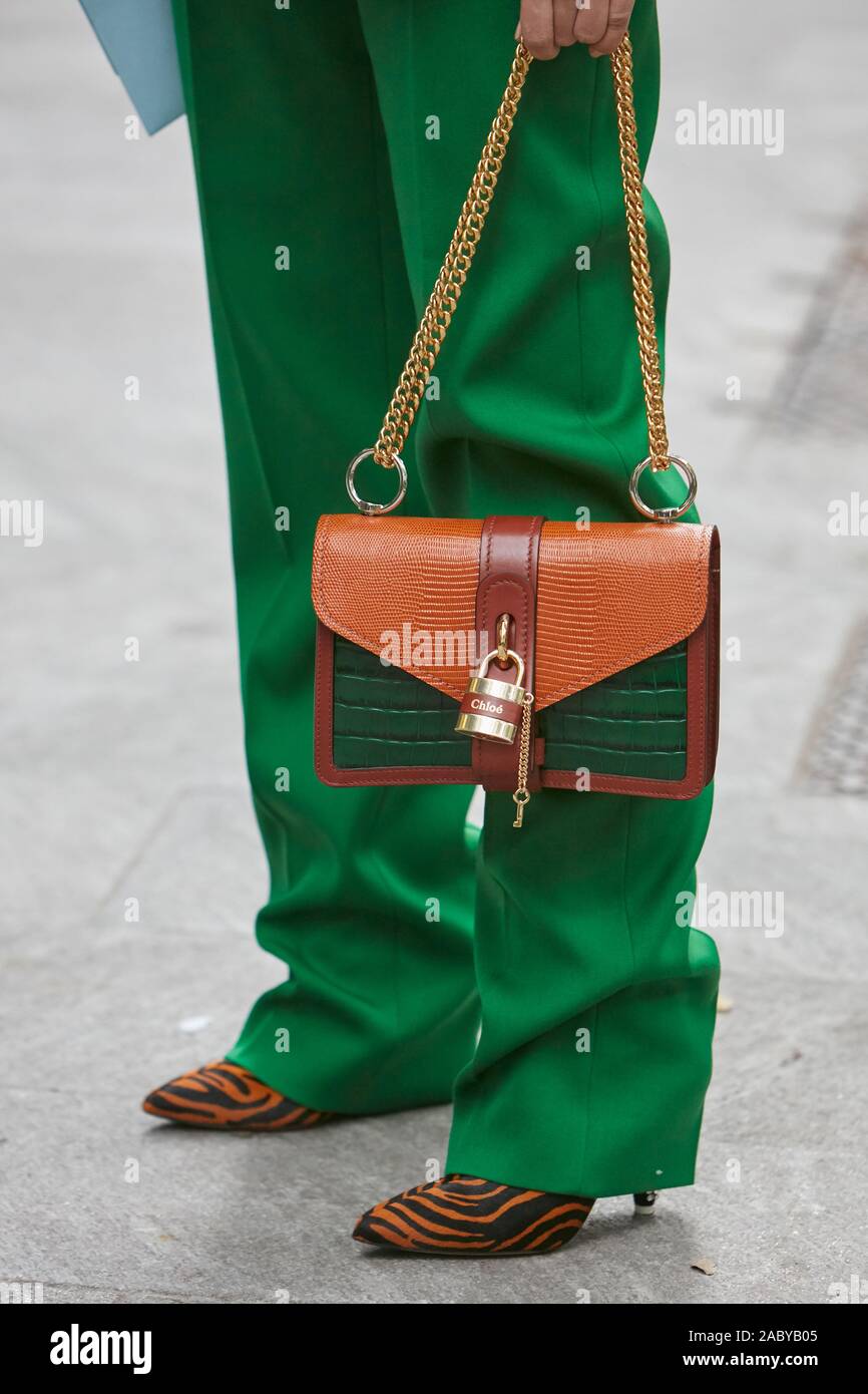 MILAN, ITALY - SEPTEMBER 19, 2019: Woman with green trousers and Chloe  brown and green leather bag before Emporio Armani fashion show, Milan  Fashion W Stock Photo - Alamy