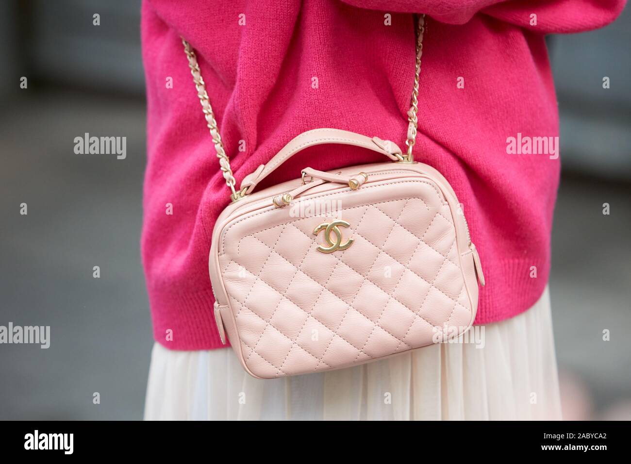 MILAN, ITALY - SEPTEMBER 19, 2019: Woman with pink Chanel leather bag and  sweater before Emporio Armani fashion show, Milan Fashion Week street style  Stock Photo - Alamy
