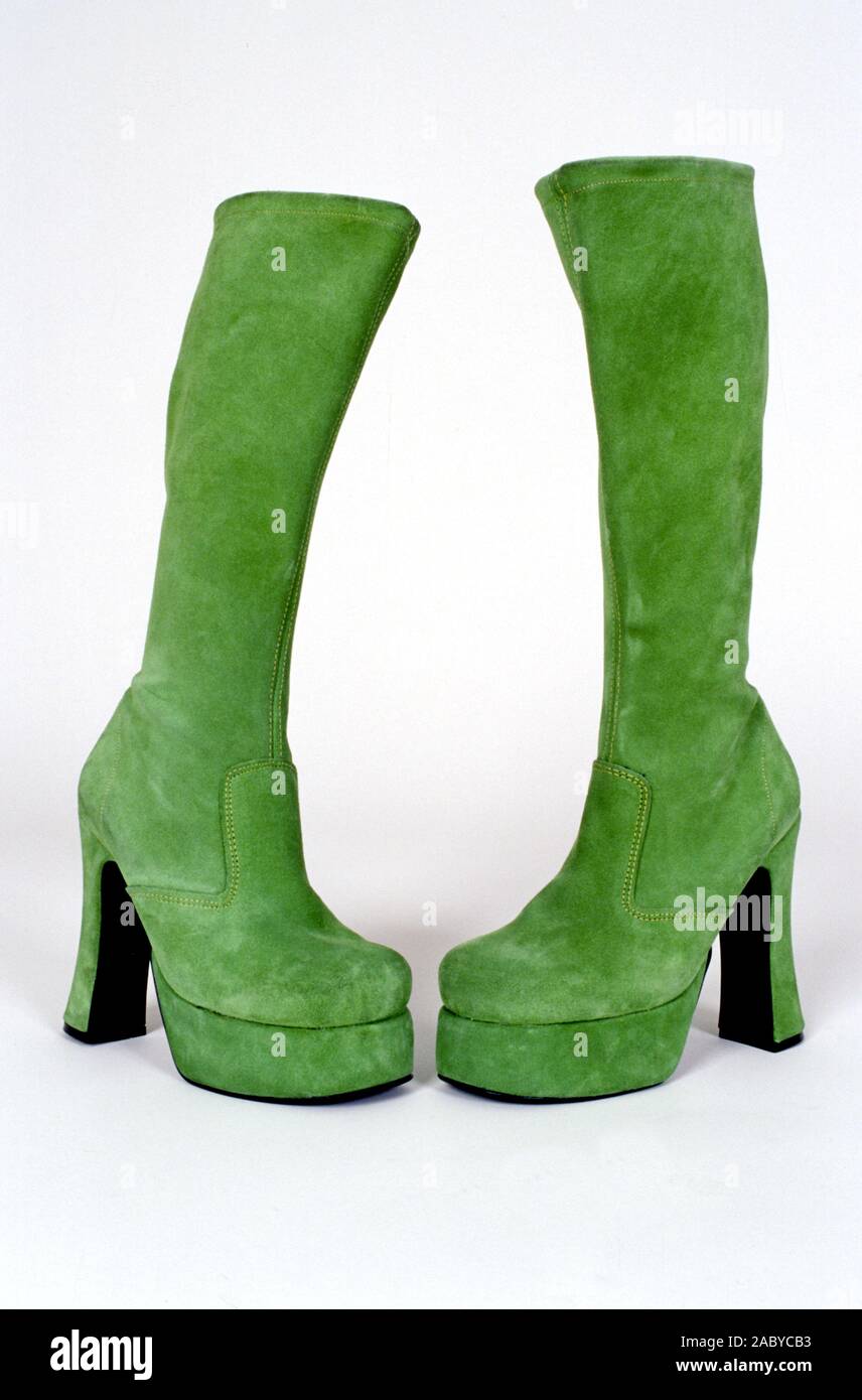 Green, high heel platform ladies swede boots. Stock Photo