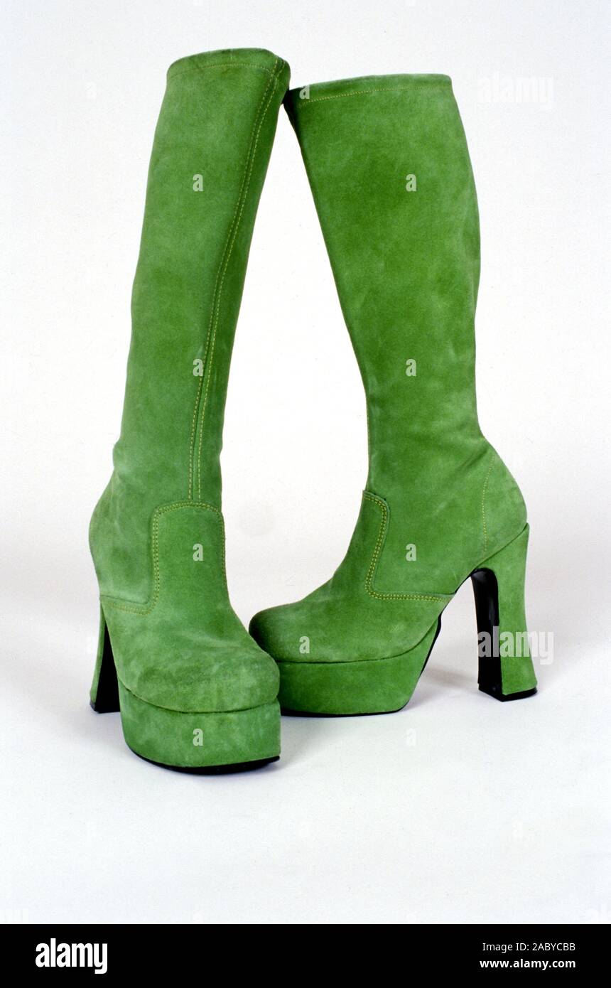 Green, high heel platform ladies swede boots. Stock Photo