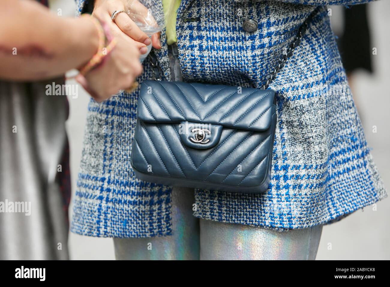 MILAN, ITALY - SEPTEMBER 21, 2018: Woman with blue Chanel leather bag  before Blumarine fashion show, Milan Fashion Week street style Stock Photo  - Alamy