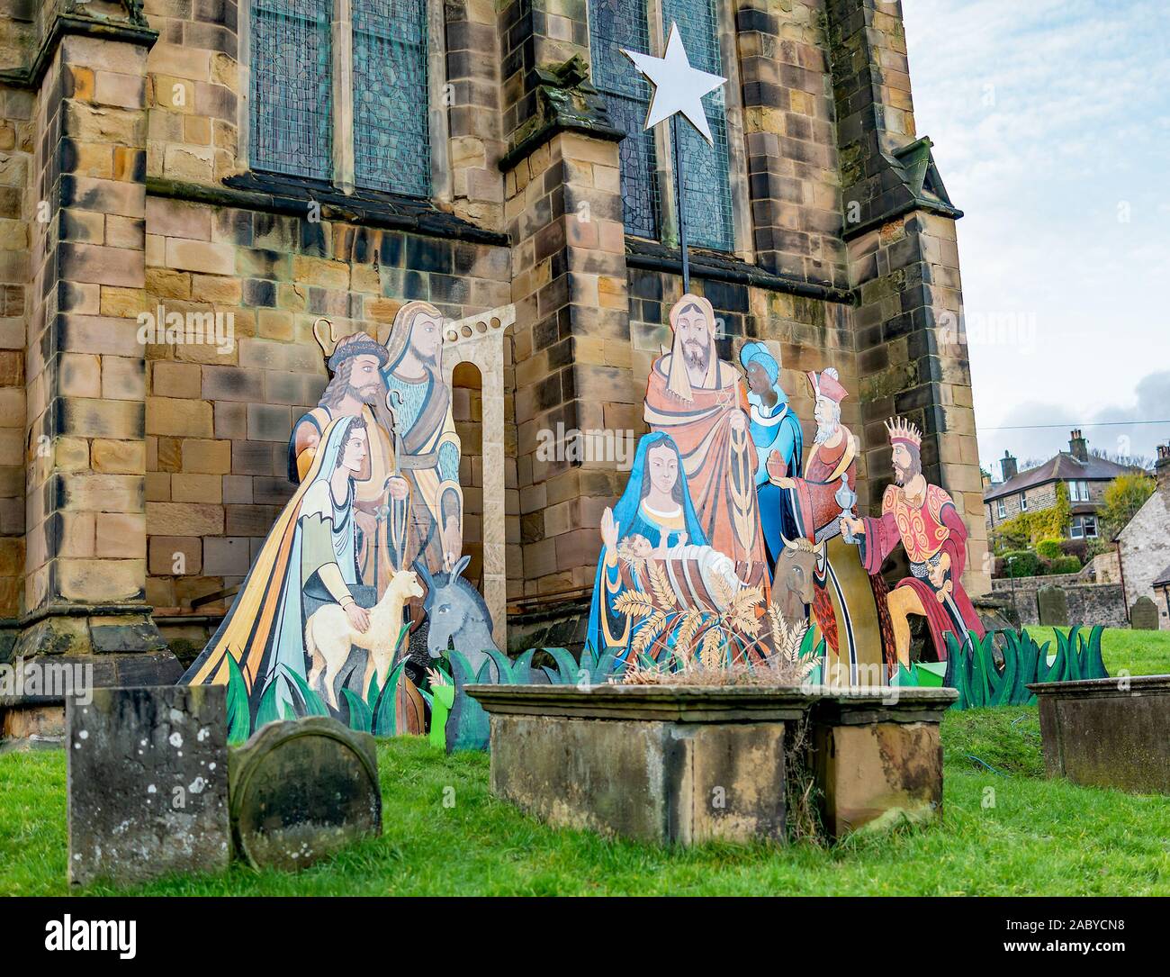 A traditional nativity scene painted on the exterior of the church in