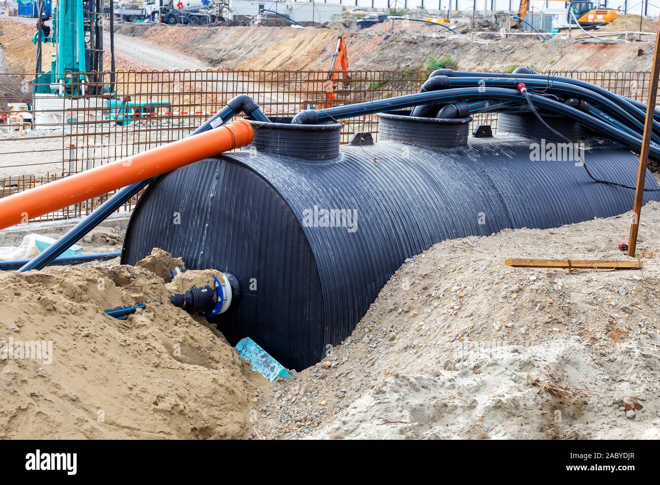 Drainage storage tank for flood water with pipes on construction site