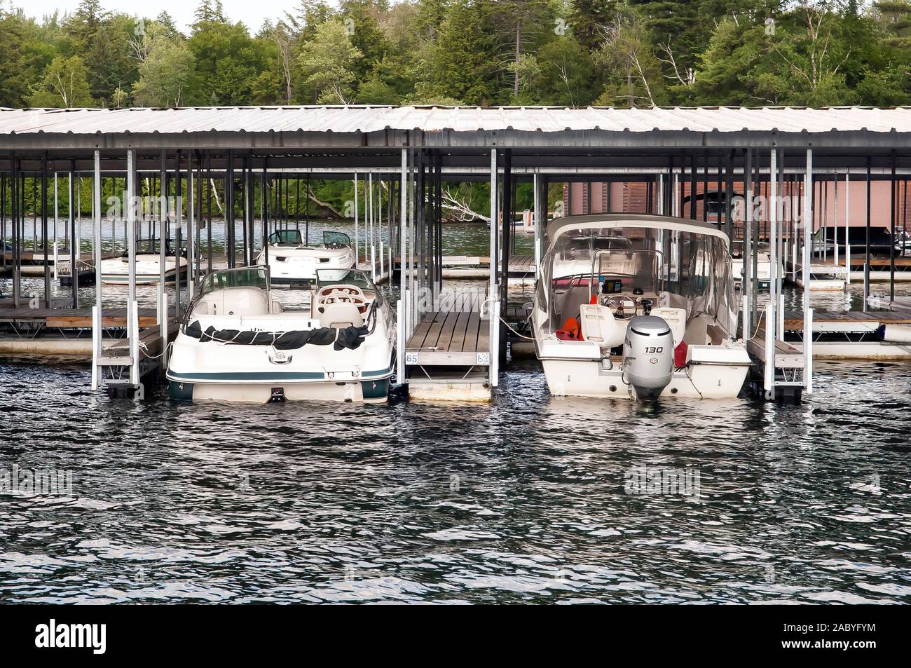 Boats moored on a pier Stock Photo - Alamy