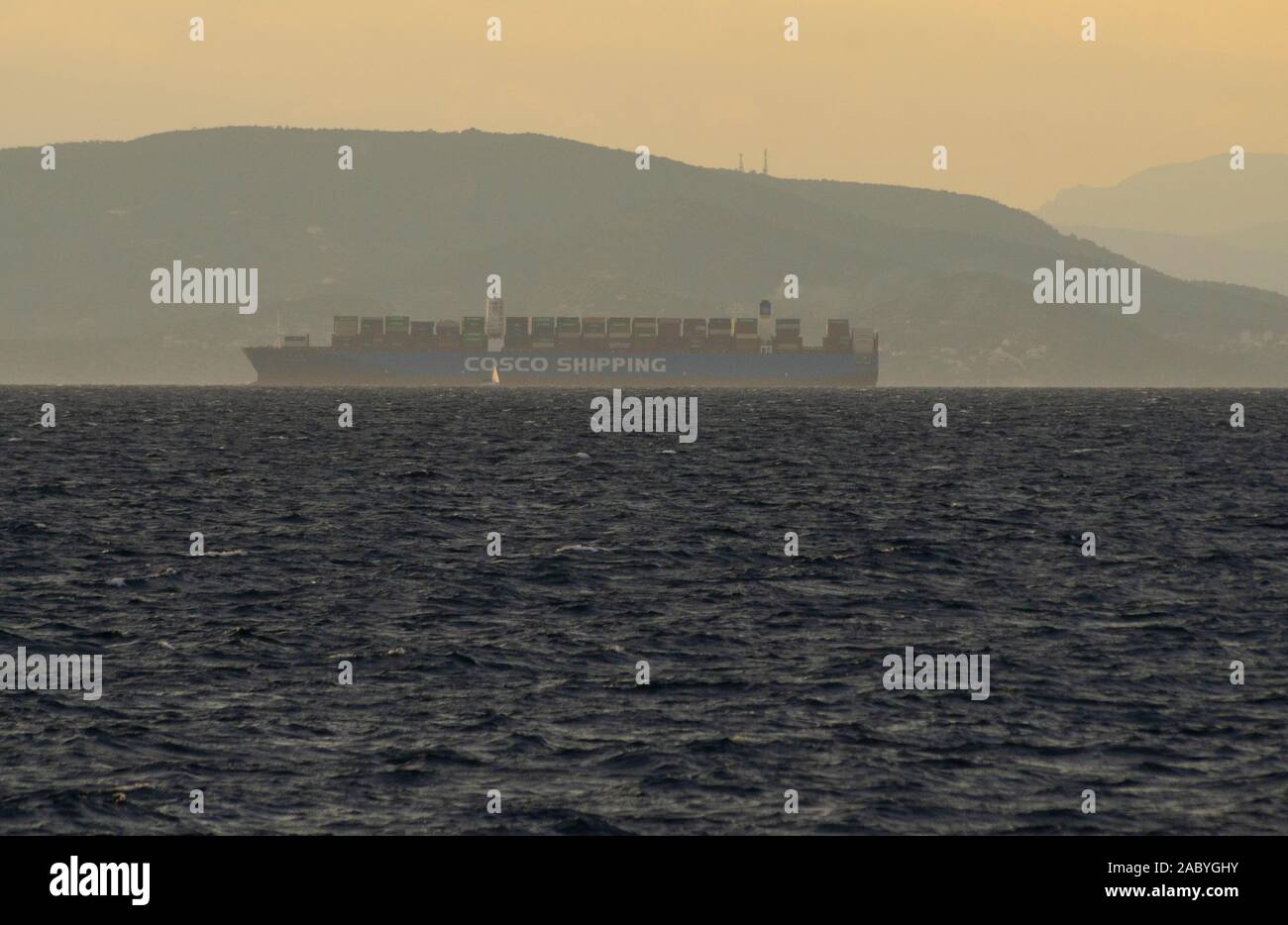 A large Cosco container ship departs from the Port of Pireaus Athens Greece Stock Photo