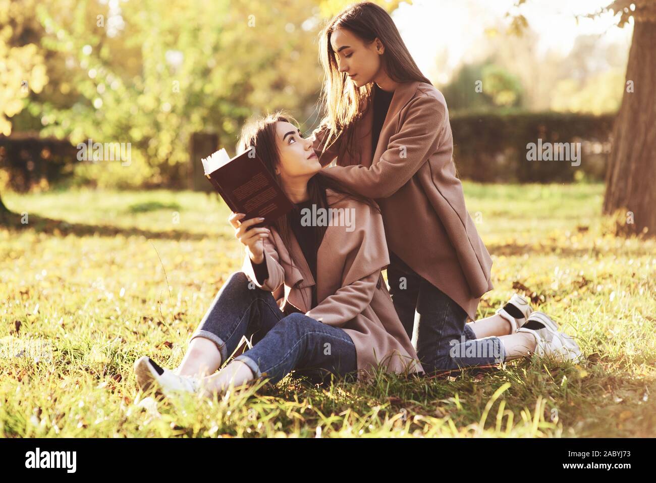 Girls holding each other hi-res stock photography and images - Alamy