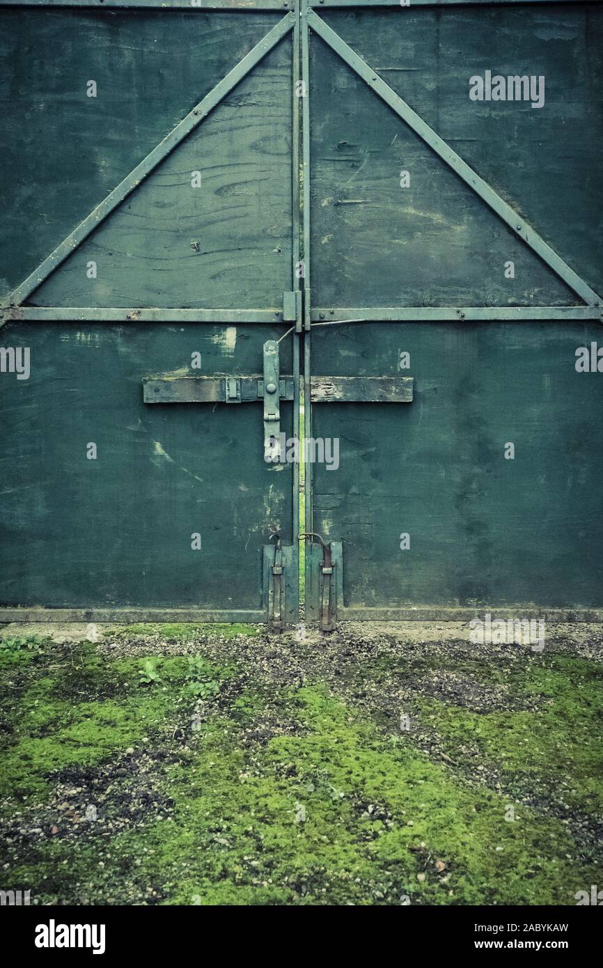 Green double plywood gates Stock Photo Alamy