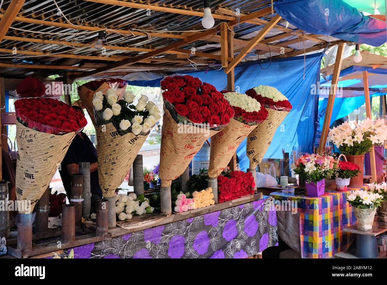 Tbilisi, June 7, 2019 Large bouquets of red roses packed in paper are for sale at the