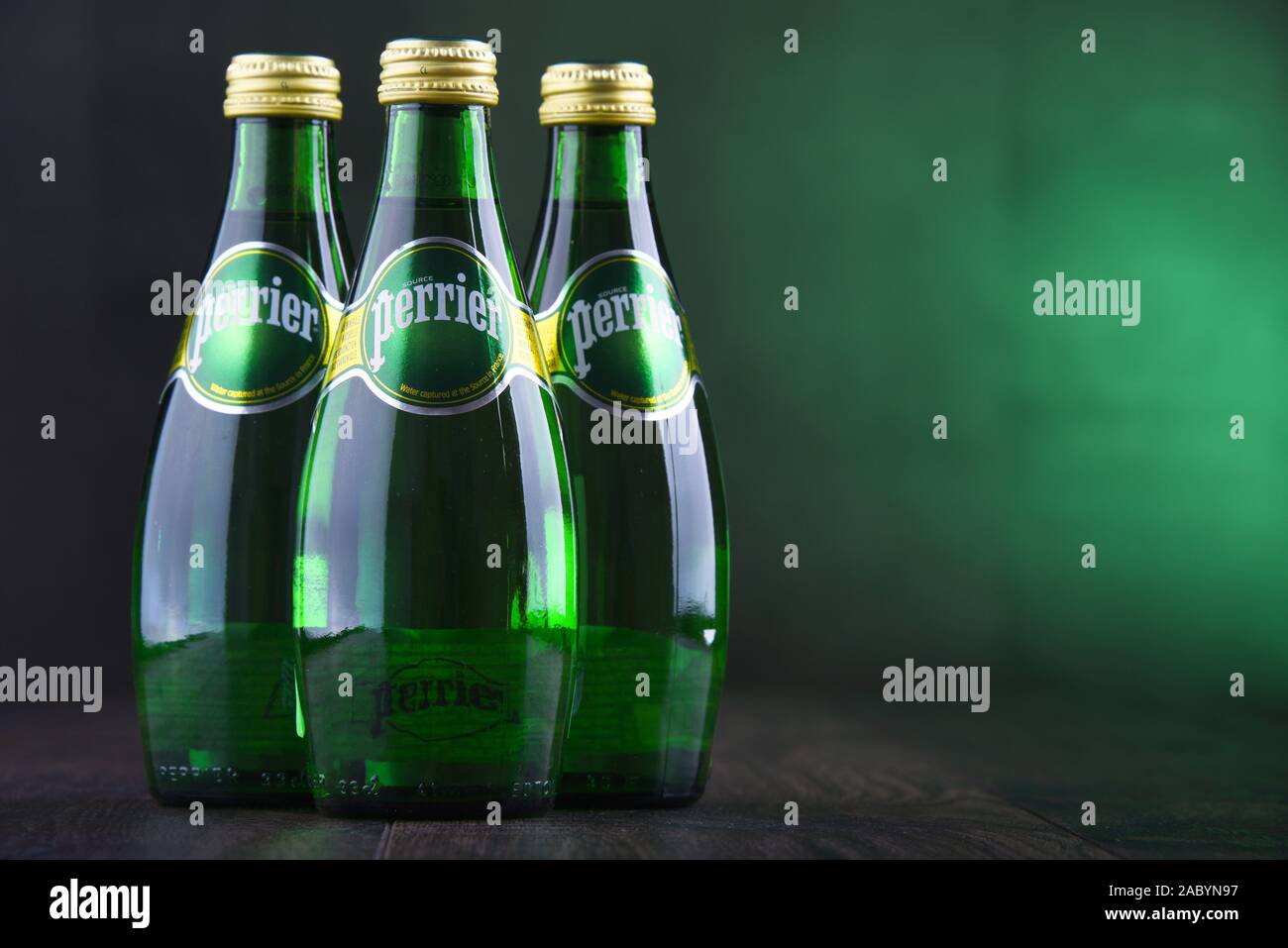 POZNAN, POL - JAN 24, 2019: Bottles of Perrier, a French brand of natural bottled mineral water sold worldwide and available in 140 countries. Stock Photo