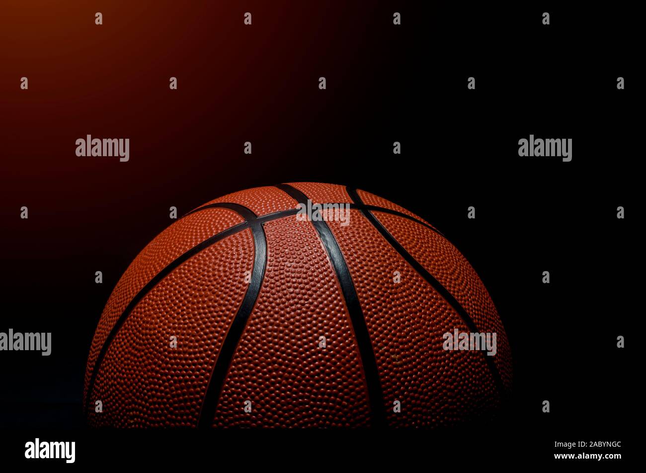 Basketball ball on black background with copy space Stock Photo