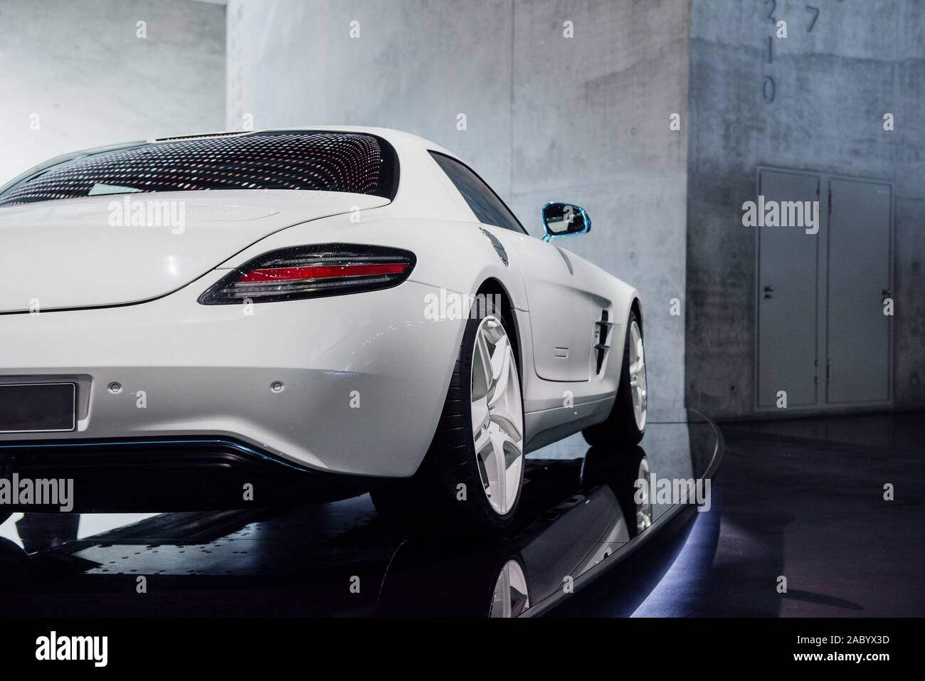 Back Side View Of White Fast Sport Car With Right Diode Backlight Blue Mirror With Turn Signal Trunk Light Alloy Wheels And Low Profile Tires Stock Photo Alamy