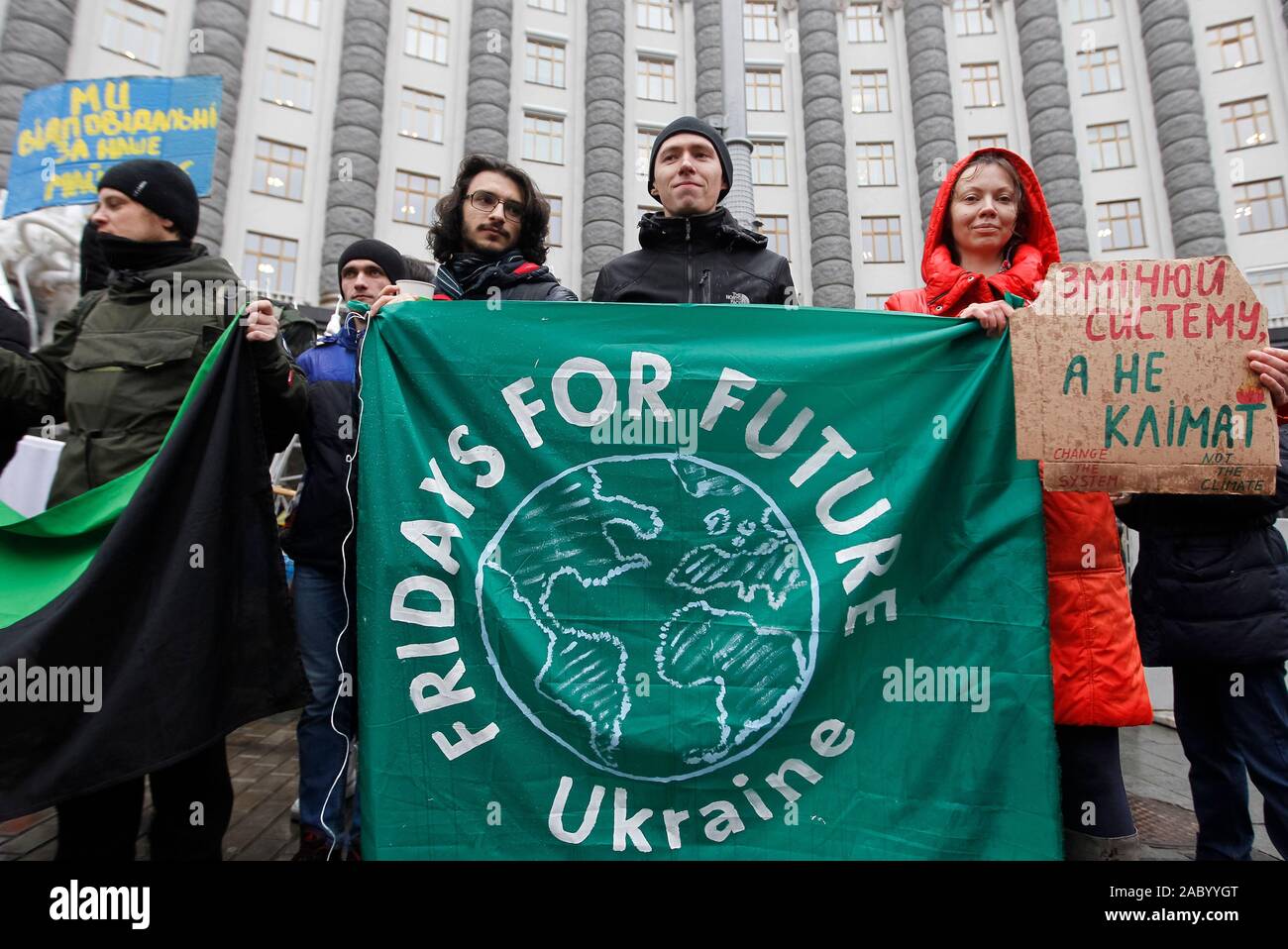 Climate activists hold the Fridays For Future banner during the Global climate strike.This is the fourth global strike in 2019, which takes place as part of the weekly demonstrations of the Fridays for Future youth movement around the world. 'Ahead of the UN COP25 Climate Change Conference in Madrid 2-13 December, the European Parliament on Thursday, approved a resolution declaring a climate and environmental emergency in Europe and globally', a press release of the European Parliament informed on November 28, 2019. Stock Photo