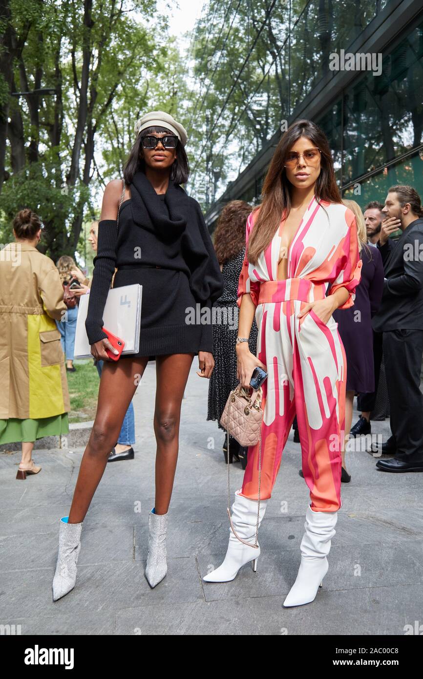 MILAN ITALY SEPTEMBER 19 2019 Women with white pink and orange dress and woman with black dress before Emporio Armani fashion show Milan Fashio Stock Photo Alamy