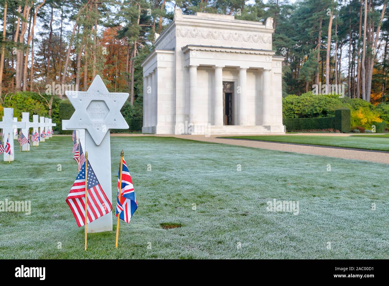 American Military Cemetery Brookwood UK for Remembrance Sunday 2019 with national flags at headstones Stock Photo
