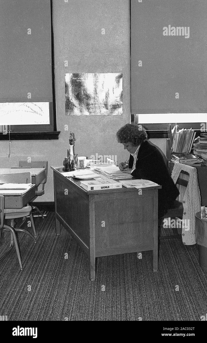 1960s Historical A Woman Working At A Small Desk Inside A Room