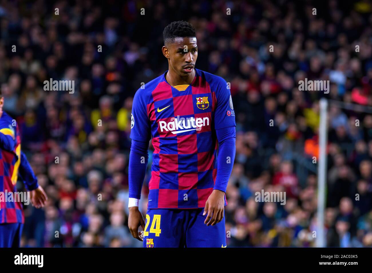 BARCELONA - NOV 27: Junior Firpo plays at the Champions League match between FC Barcelona and Borussia Dortmund at the Camp Nou Stadium on November 27 Stock Photo