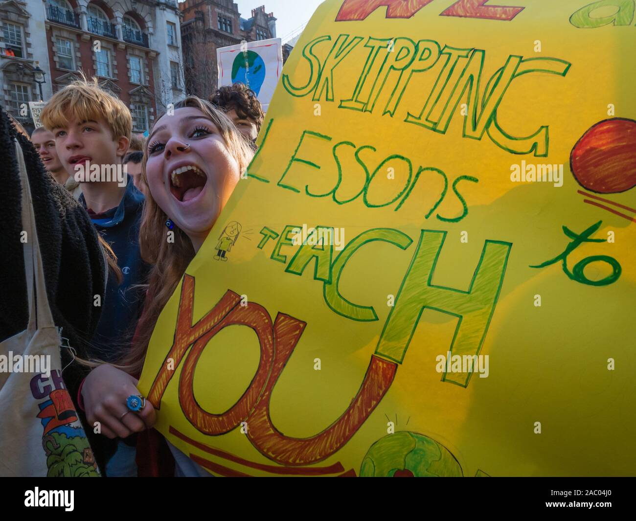London, UK. 29th Nov, 2019. Students march on Black Friday/Buy Nothing Day demanding urgent climate action. They demand a Green New Deal to save the future, a curriculum that teaches the future, for government to tell people the truth and for young people to be empowered and their views heard. Over a thousand marched up Whitehall but were stopped by police on Regent St, and led eventually back to Parliament Square were they met the UCU led march for Planet, Pay, Pensions. Credit: Peter Marshall/Alamy Live News Stock Photo