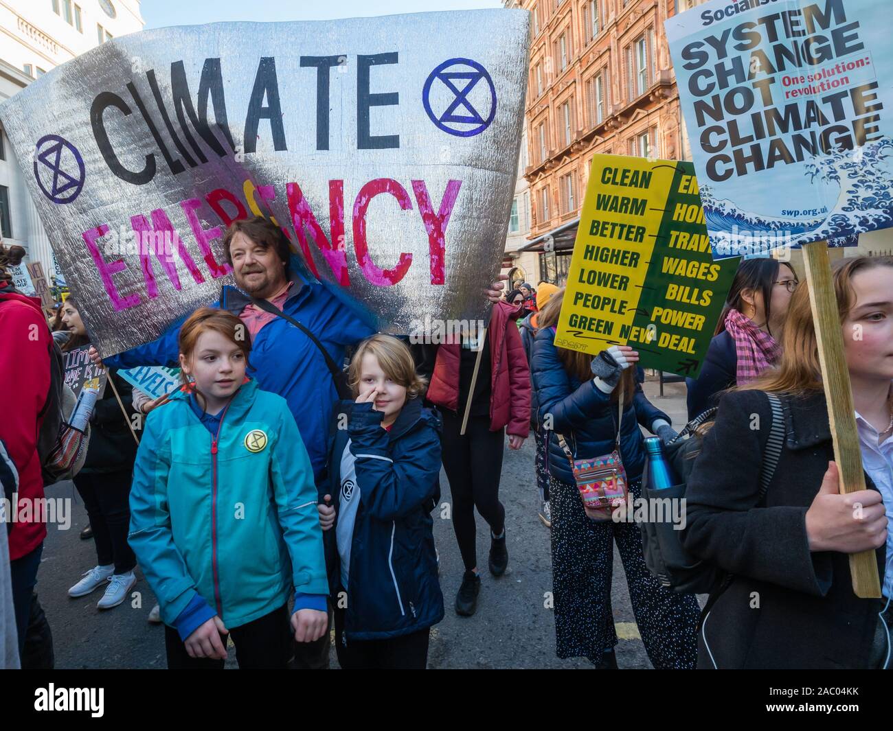 London, UK. 29th Nov, 2019. Students march with posters through Trafalgar Square on Black Friday/Buy Nothing Day demanding urgent climate action. They demand a Green New Deal to save the future, a curriculum that teaches the future, for government to tell people the truth and for young people to be empowered and their views heard. Over a thousand marched up Whitehall but were stopped by police on Regent St, and led eventually back to Parliament Square were they met the UCU led march for Planet, Pay, Pensions. Credit: Peter Marshall/Alamy Live News Stock Photo