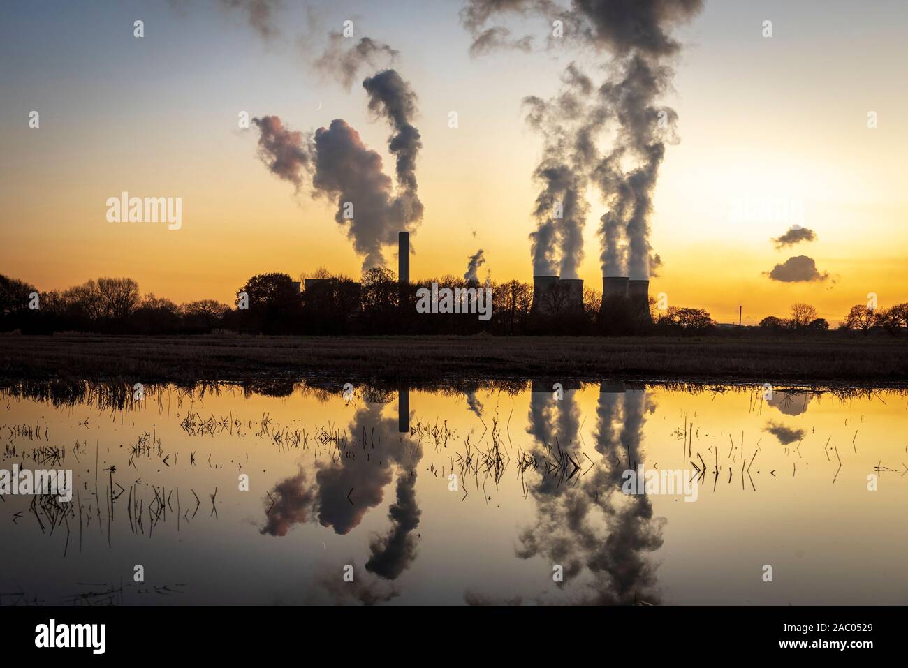 Fiddlers Ferry coal fired power station at sunset on winter evening. Reflection Stock Photo