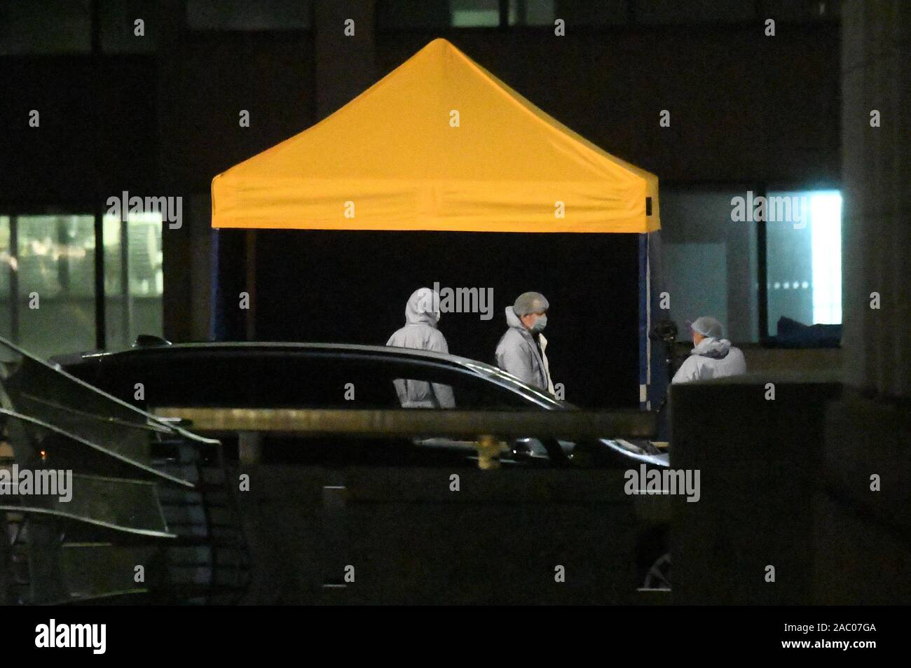 Forensic officers at the scene of an incident on London Bridge in central London after a terrorist wearing a fake suicide vest who went on a knife rampage was shot dead by police. Stock Photo