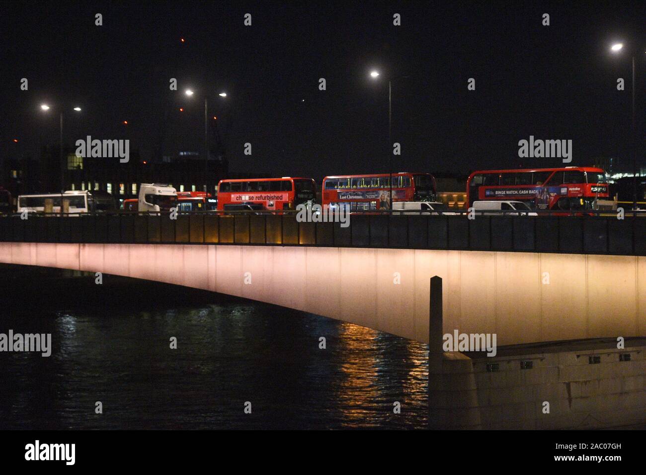 Abandoned vehicles including buses on London Bridge in central London after a terrorist wearing a fake suicide vest who went on a knife rampage was shot dead by police. Stock Photo