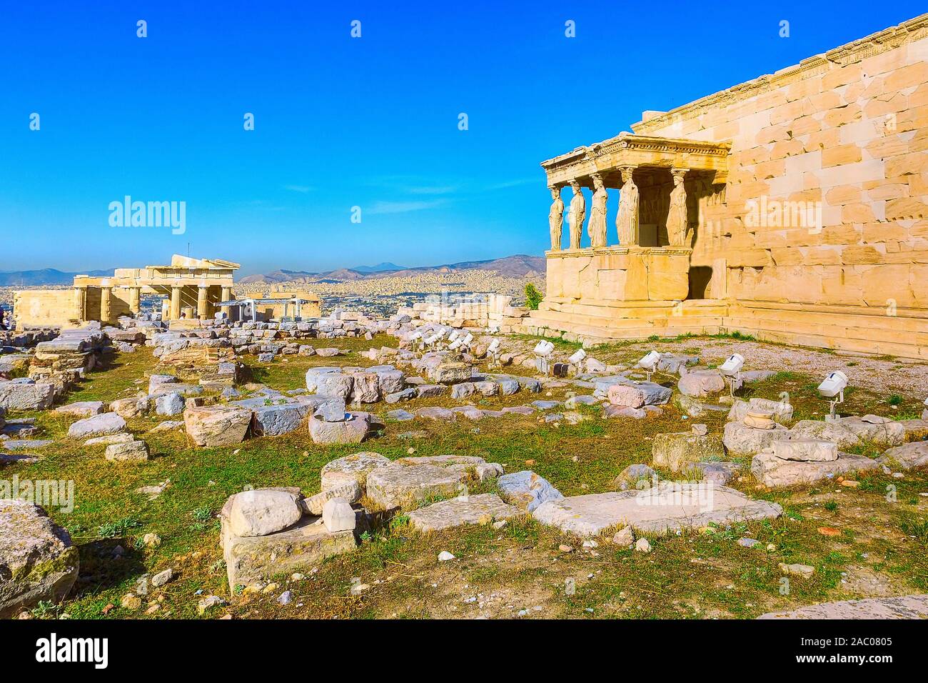 Acropolis, porch of caryatids, Erechtheum Temple in Athens, Greece and blue sky Stock Photo