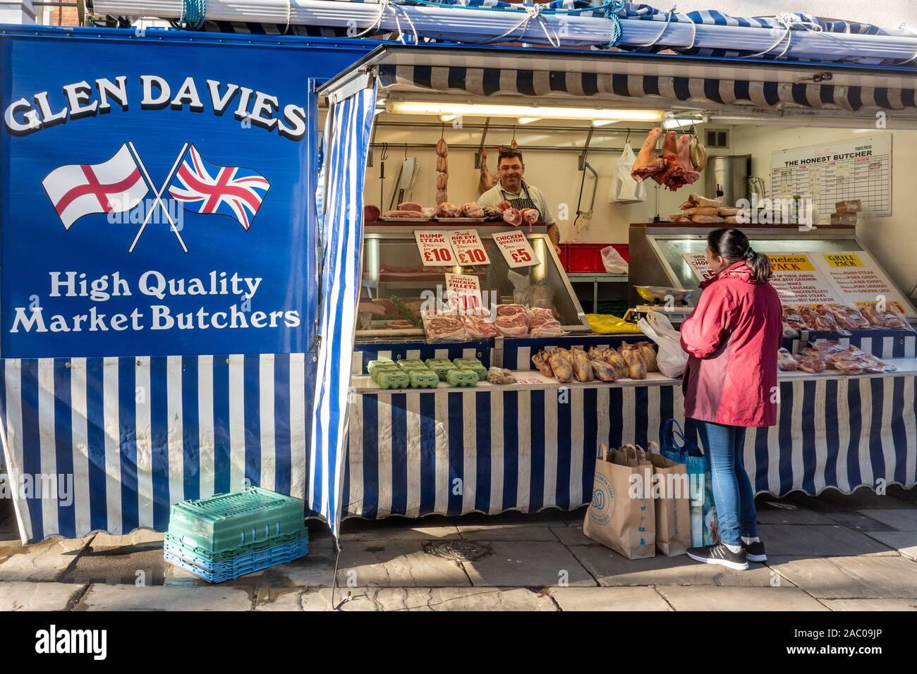 Glen Davies market stall, high quality market butcher selling meat and other produce, UK Stock Photo