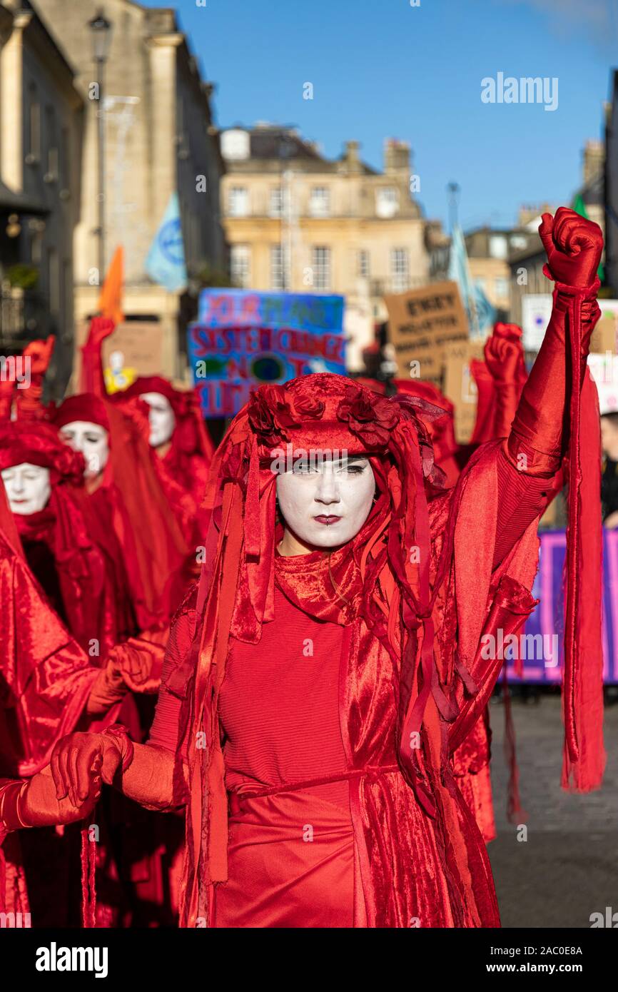 Extinction Rebellion Red Brigade climate change protesters march through Bath City centre with Bath Youth Climate Alliance campaigning for action of Climate Change. Bath UK. 29th November, 2019, England, UK Stock Photo