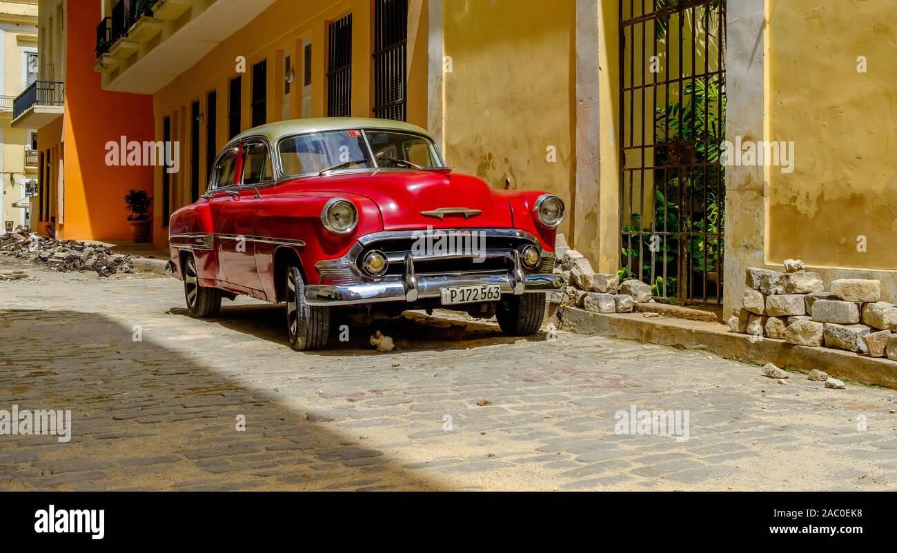 Havana, Cuba, July 2019, view of a red 1950s Chevrolet in an old part of the capital Stock Photo