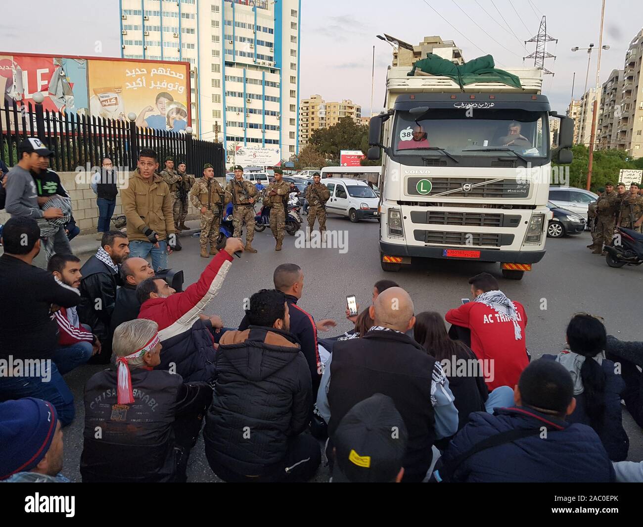 Tripoli, Lebanon, 29th Nov 2019. Demonstrators block the road in Tripoli, northern Lebanon, Nov. 29, 2019. Gas stations in Lebanon continued their strike on Friday even as demonstrators used their cars to block the roads in protest of the unavailability of gasoline, Al Jadeed TV channel reported. (Photo by Khalid/Xinhua) Credit: Xinhua/Alamy Live News Stock Photo