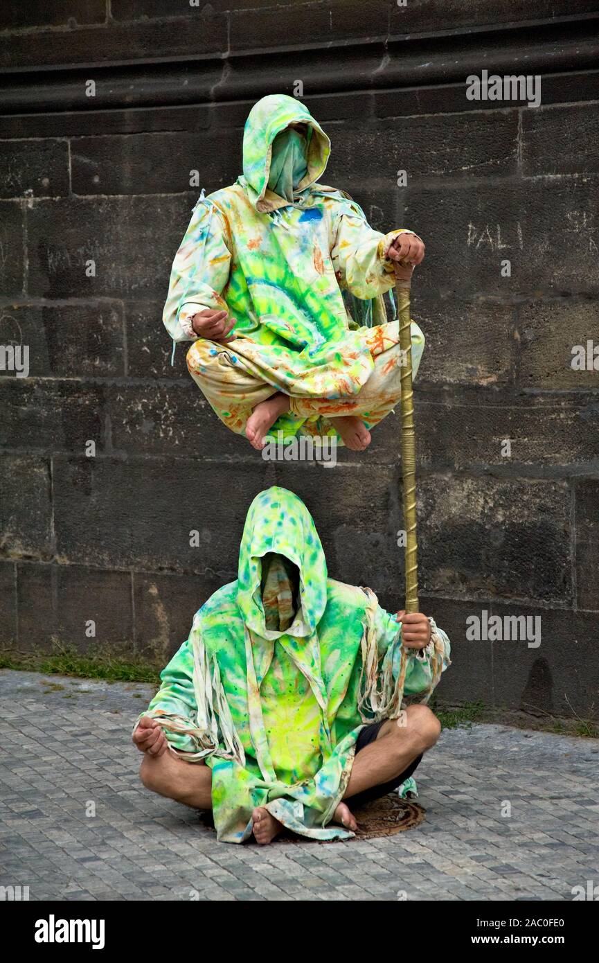 Street performers entertain a crowd in the capital city of Prague. Stock Photo
