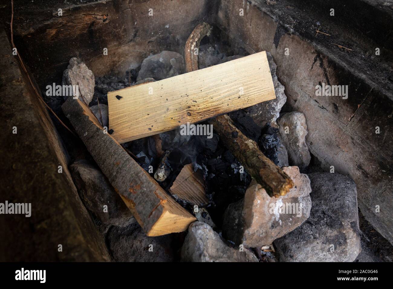 wood burn to light a fire to cook grilled meat Stock Photo