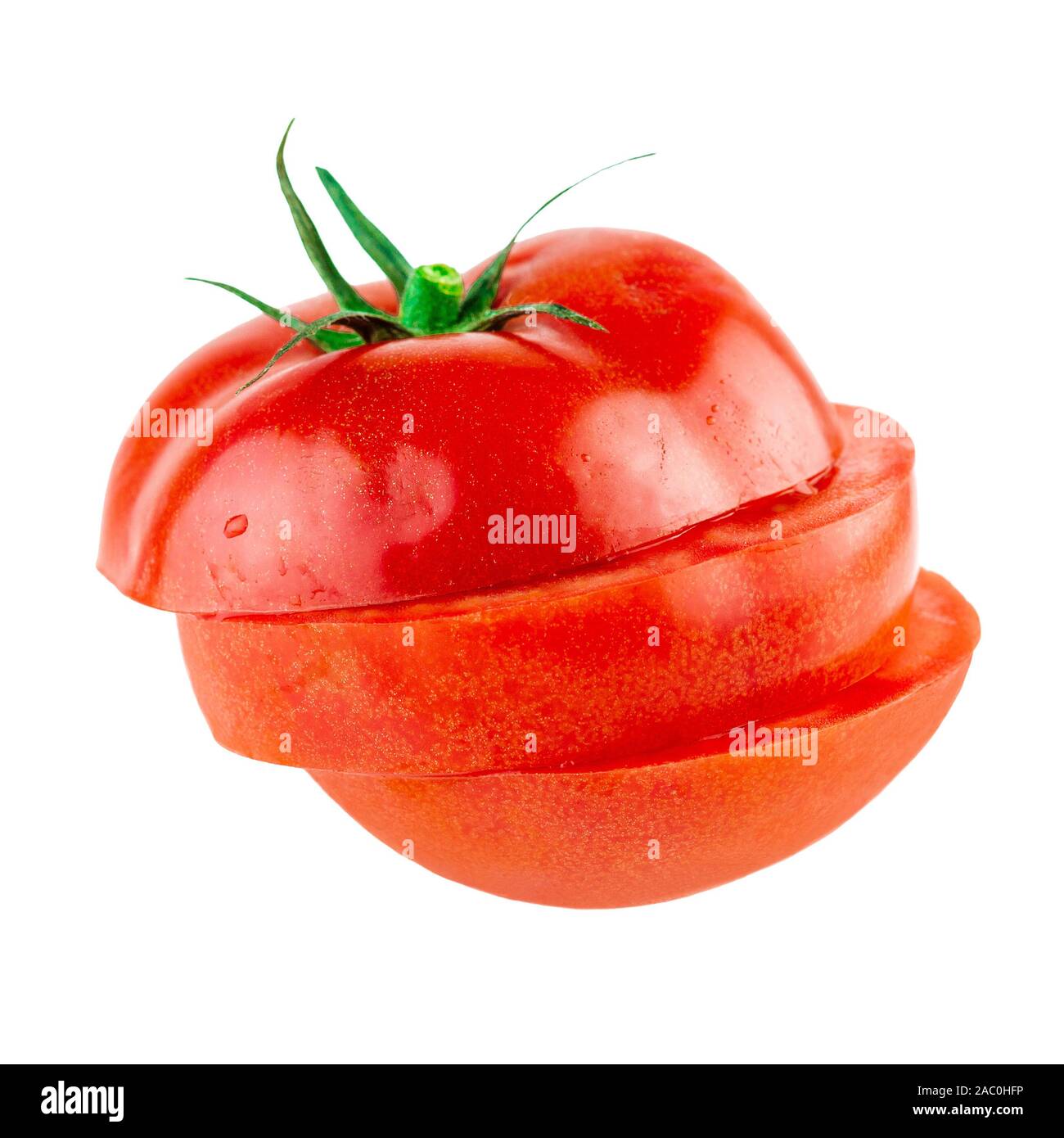 Tomato sliced in a pile isolated on white Stock Photo