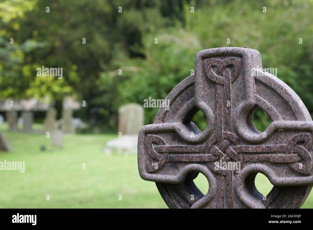 Gravestone in cemetary with celtic knot design Stock Photo