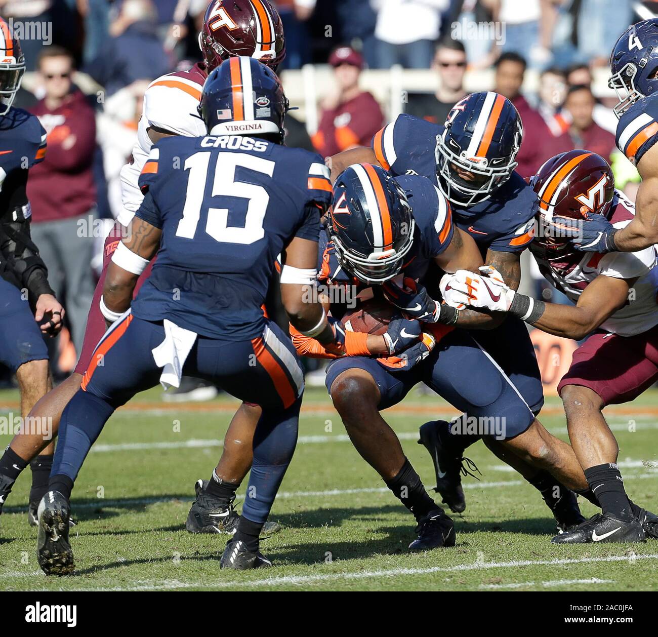 Charlottesville, Virginia, USA. 29th Nov, 2019. Virginia Cavaliers OLB #14 Noah Taylor causes a turnover during NCAA football game between the University of Virginia Cavaliers and the Virginia Tech Hokies at Scott Stadium in Charlottesville, Virginia. Justin Cooper/CSM/Alamy Live News Stock Photo
