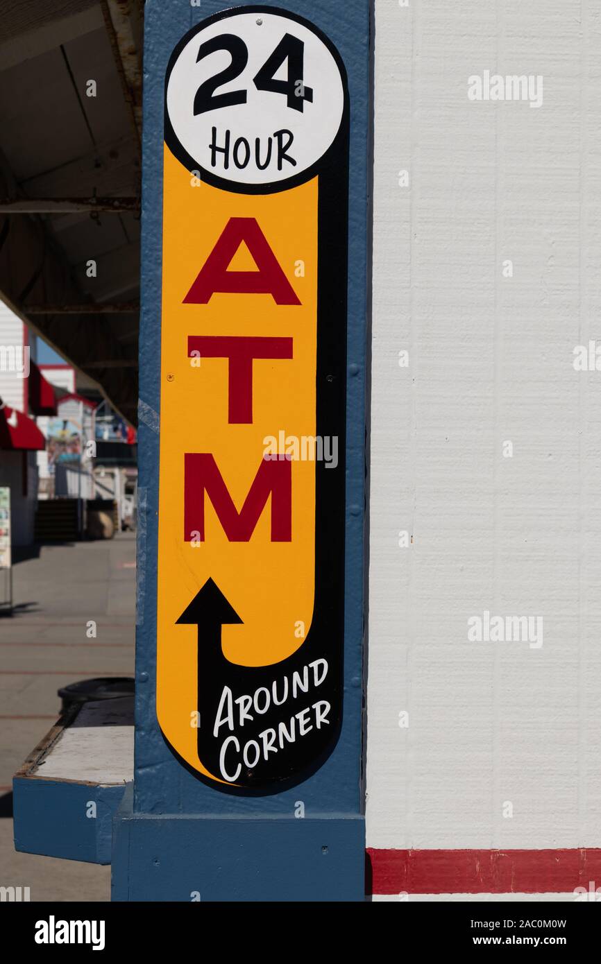 ATM sign 24 hours access to money Stock Photo - Alamy