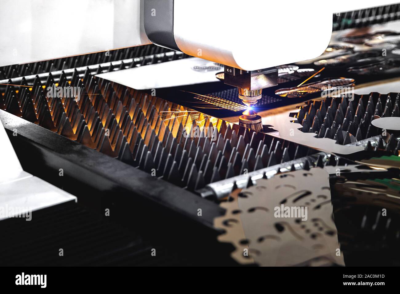 Machining CNC laser cutting metal sheet,High precision technology Stock Photo