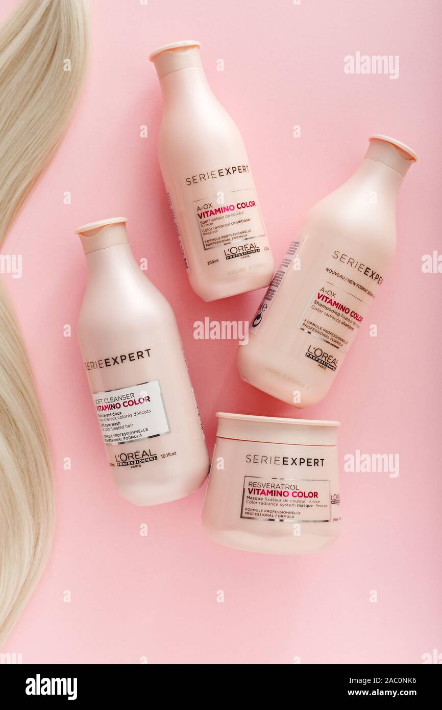 L Oreal Professionnel Paris Serie Expert Vitamino Color Hair Professional Products Set Loreal Hair Shampoo Mask Strand Of Blonde Hair On Pink Stock Photo Alamy