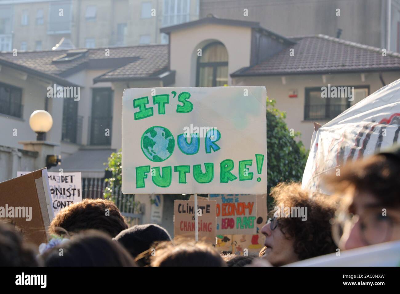 Turin, Italy. 29th November 2019. Teenagers show a home-made placard during the Global Climate Strike declared by Fridays for Future. Credit: MLBARIONA/Alamy Live News Stock Photo