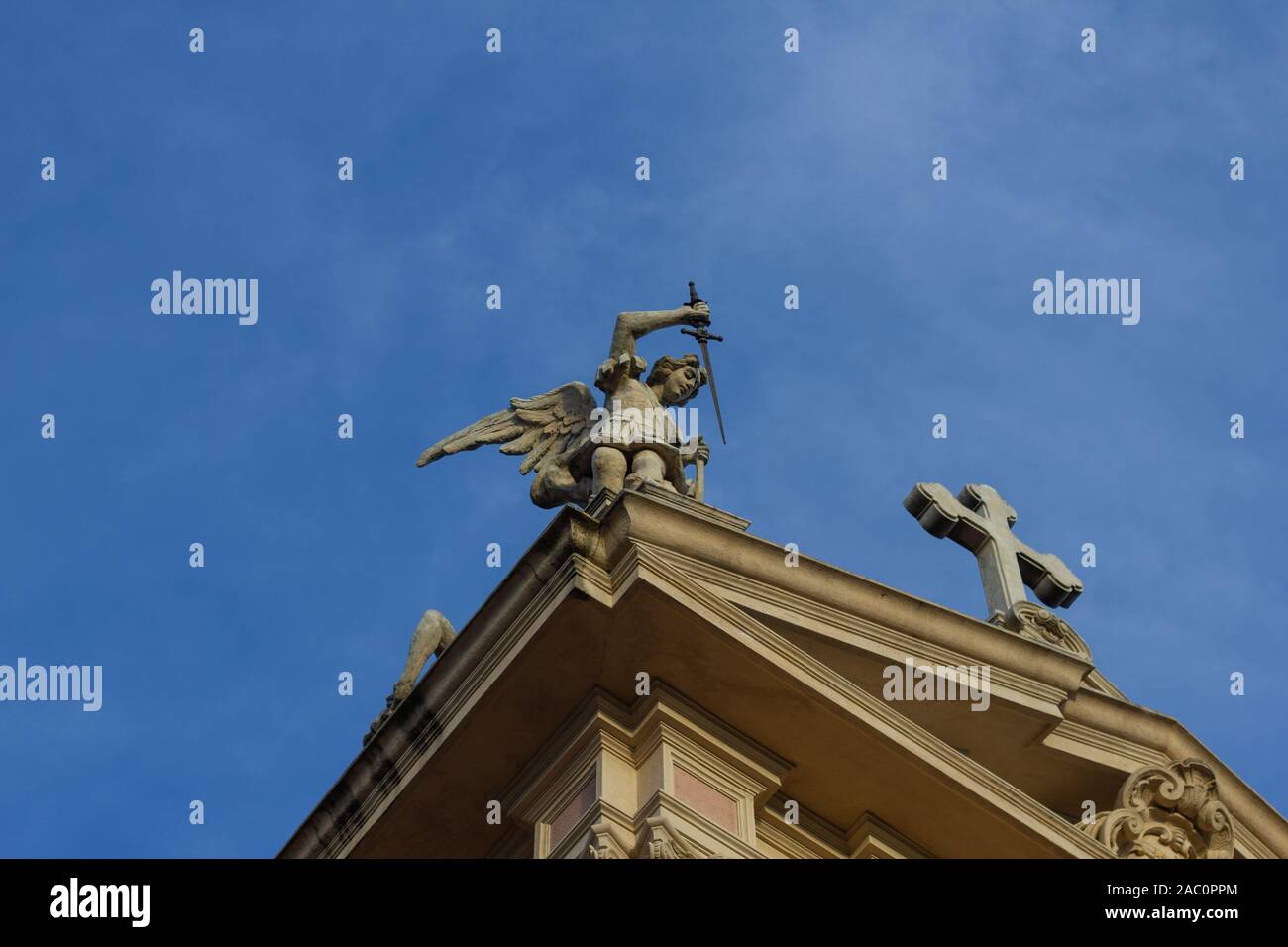 The statue of the archangel Michael with a sword in his hand above the ...