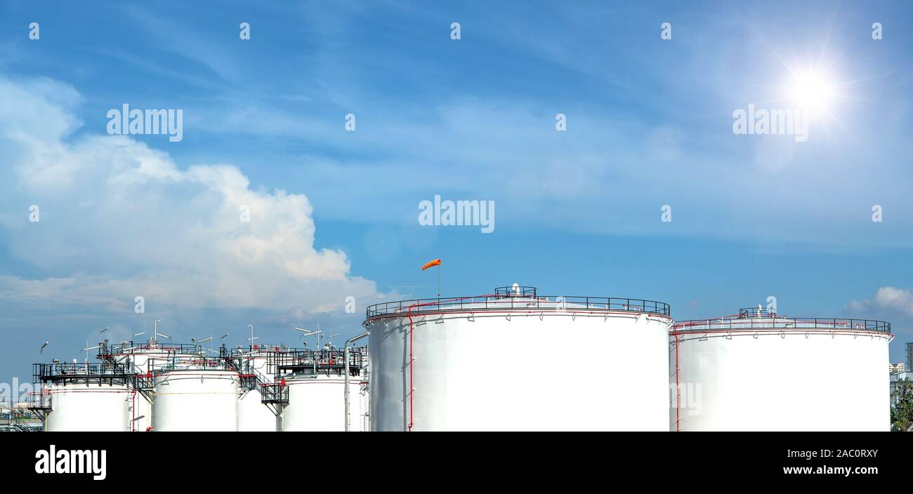 Oil and gas refinery storage tank and Detail of equipment oil pipeline steel with valve for industrail petroleum. Stock Photo