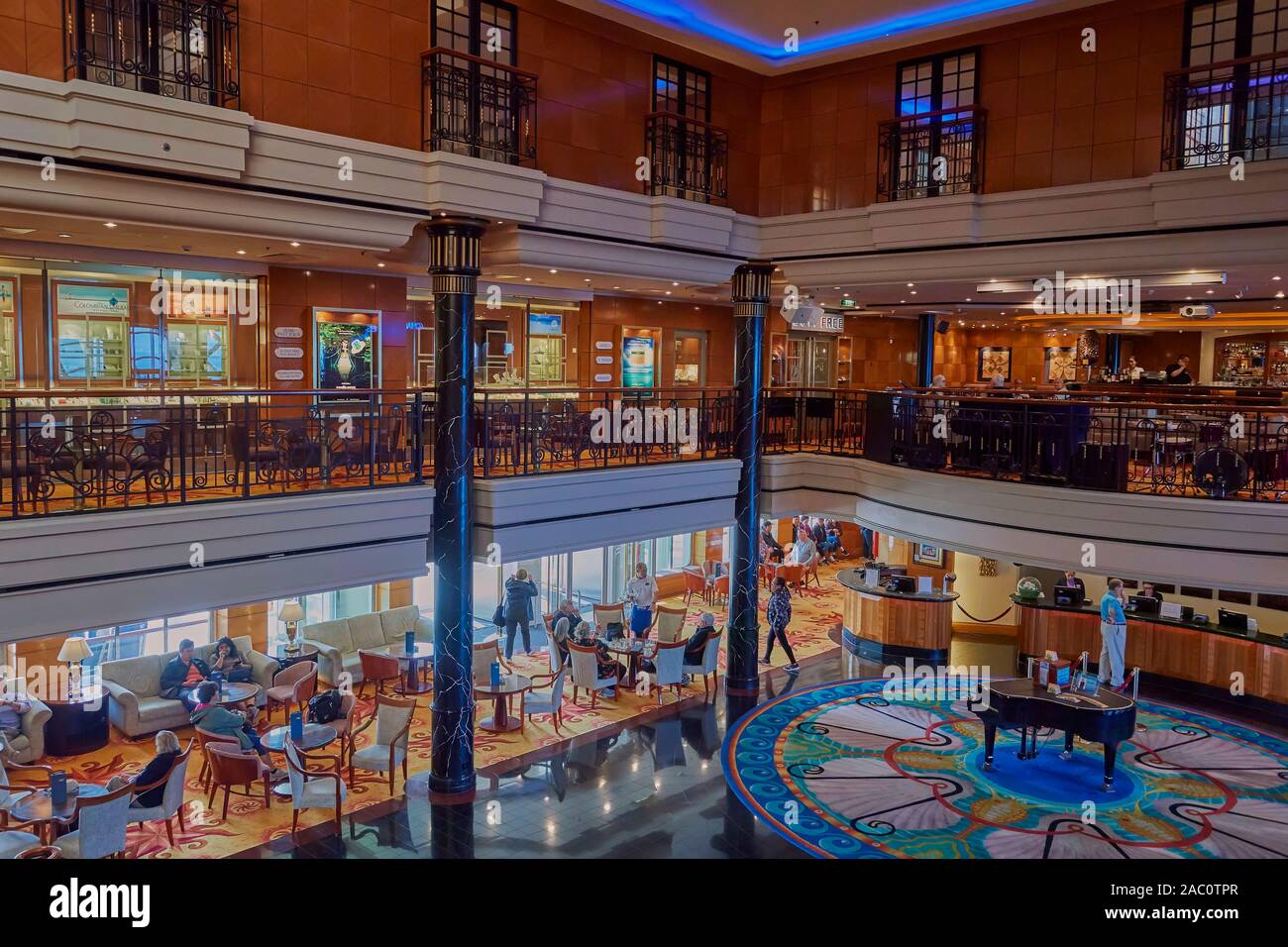 Taken on board the Norwegian Spirit cruise ship on one of the shopping and cafe decks and Atrium. Stock Photo