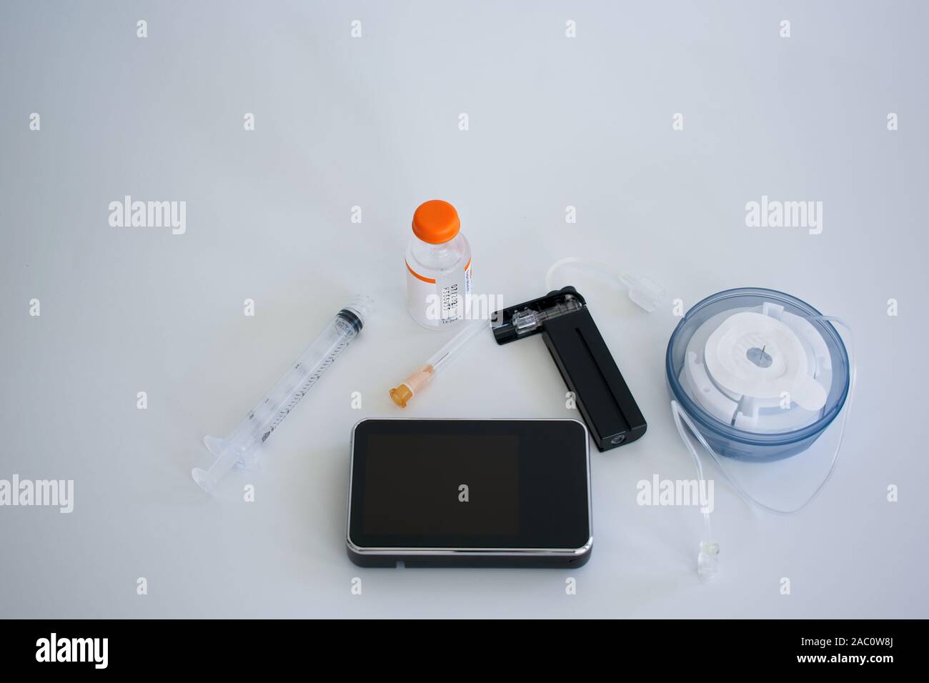Insulin pump equipment includes infusion set, cartridge and insulin vial. Stock Photo