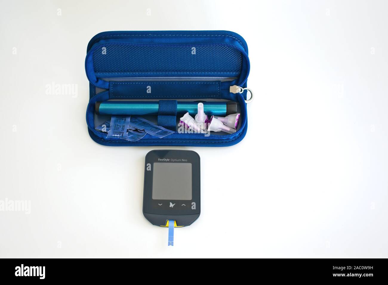 Diabetes test kit and insulin pen. Stock Photo