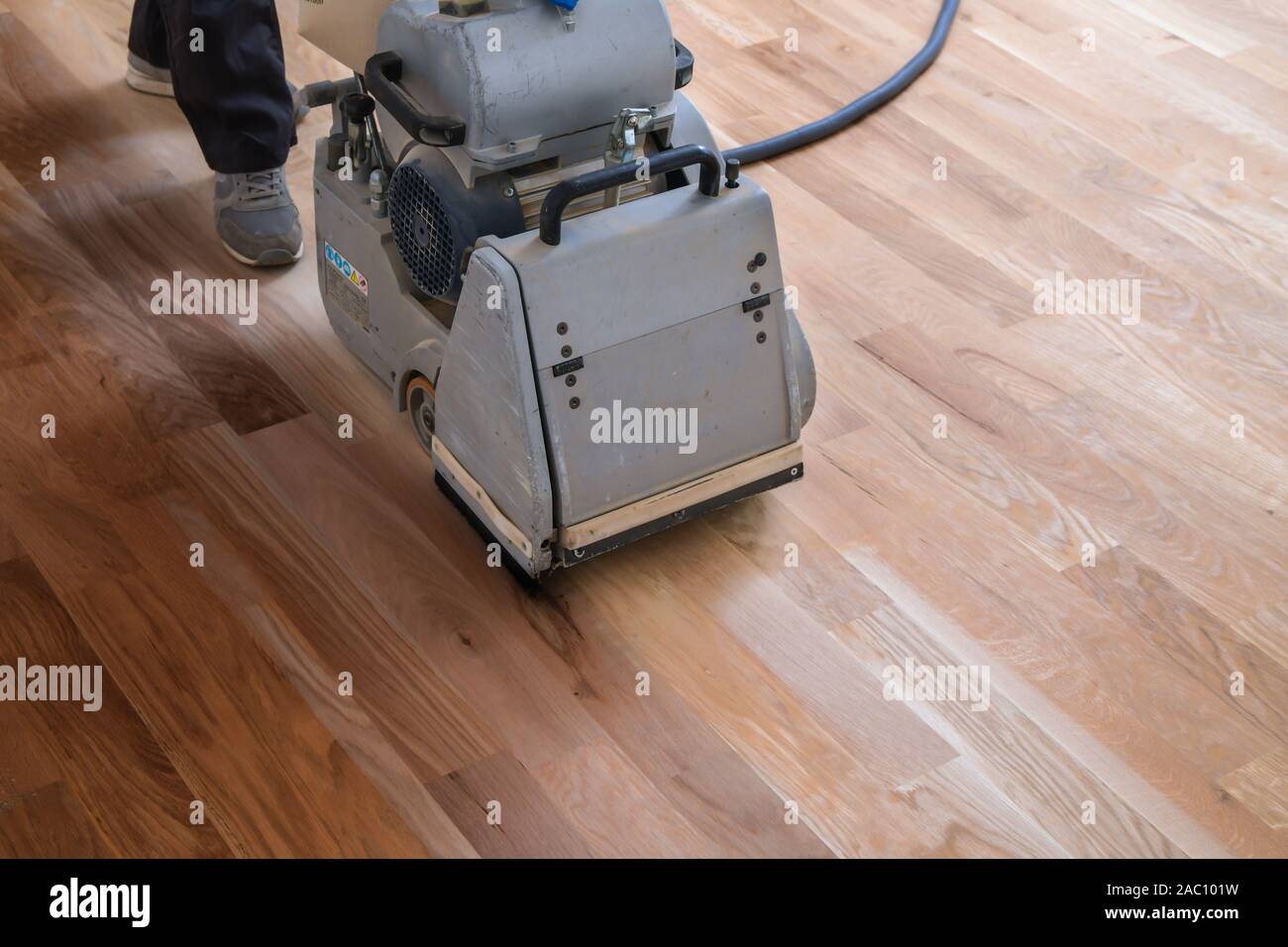Scraping Hardwood Floor With The Grinding Machine Repair In The